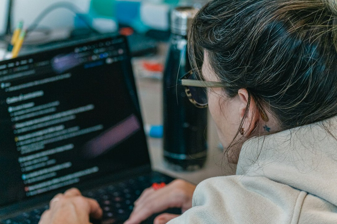 woman coding on computer