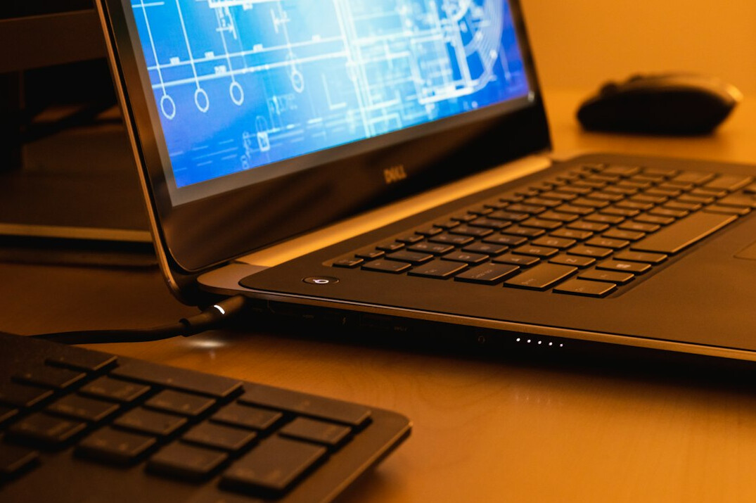 coding on laptop at home